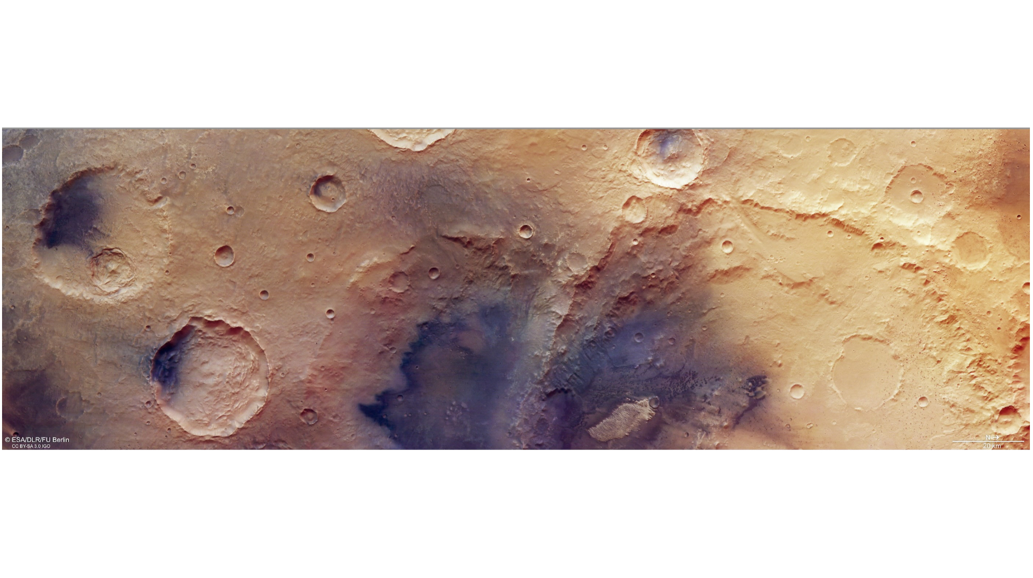image of the mars surface taken by a mars orbiter, showing several large, heavily eroded craters