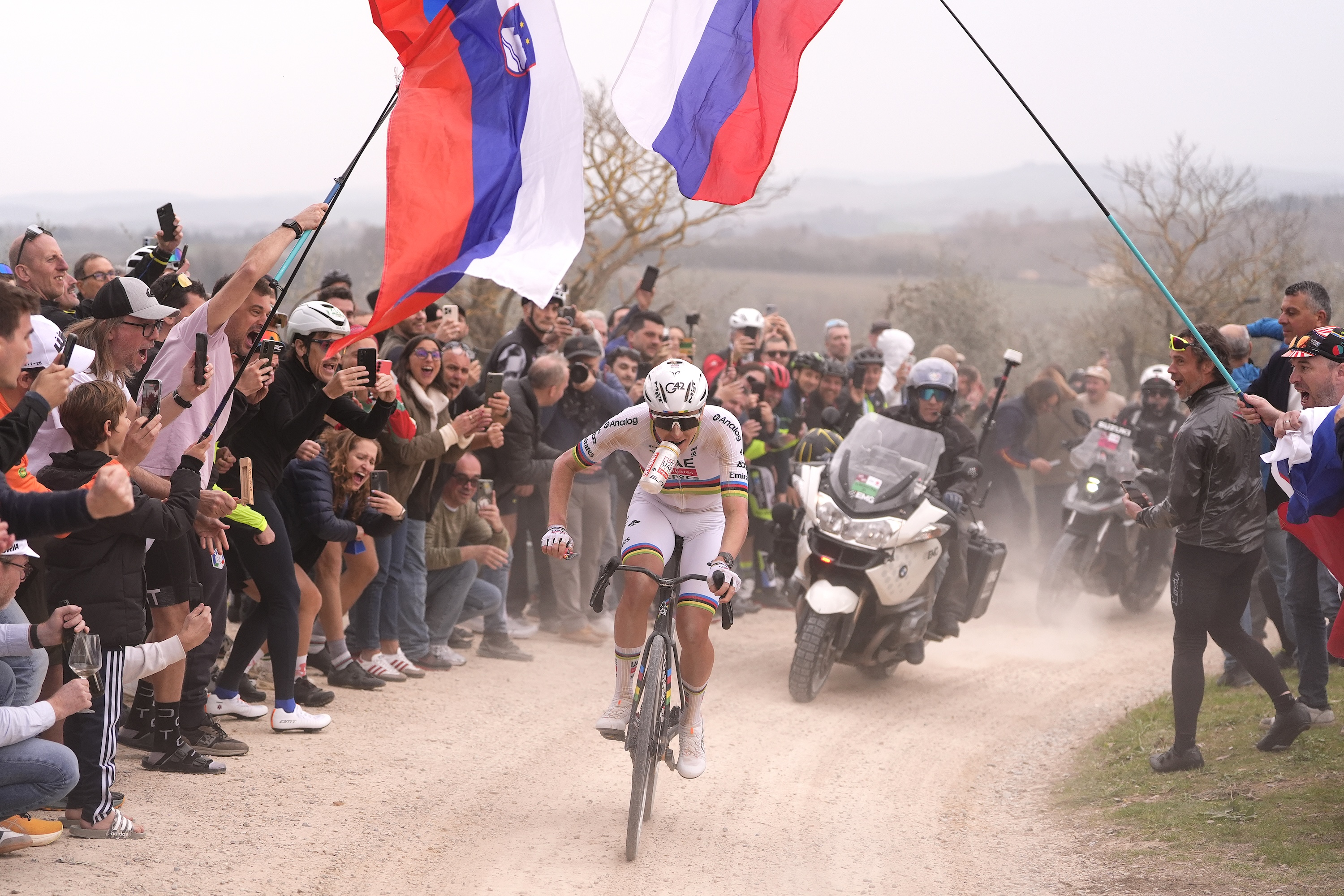 SIENA, ITALY - MARCH 07: Tadej Pogacar of Slovenia and UAE Team Emirates - XRG competes in the breakaway while fans cheers during the 20th Strade Bianche 2026 a 203km one day race from Siena to Siena / #UCIWT / on March 07, 2026 in Siena, Italy. (Photo by Fabio Ferrari - Pool/Getty Images)