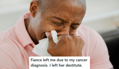 Man in pink t-shirt crying