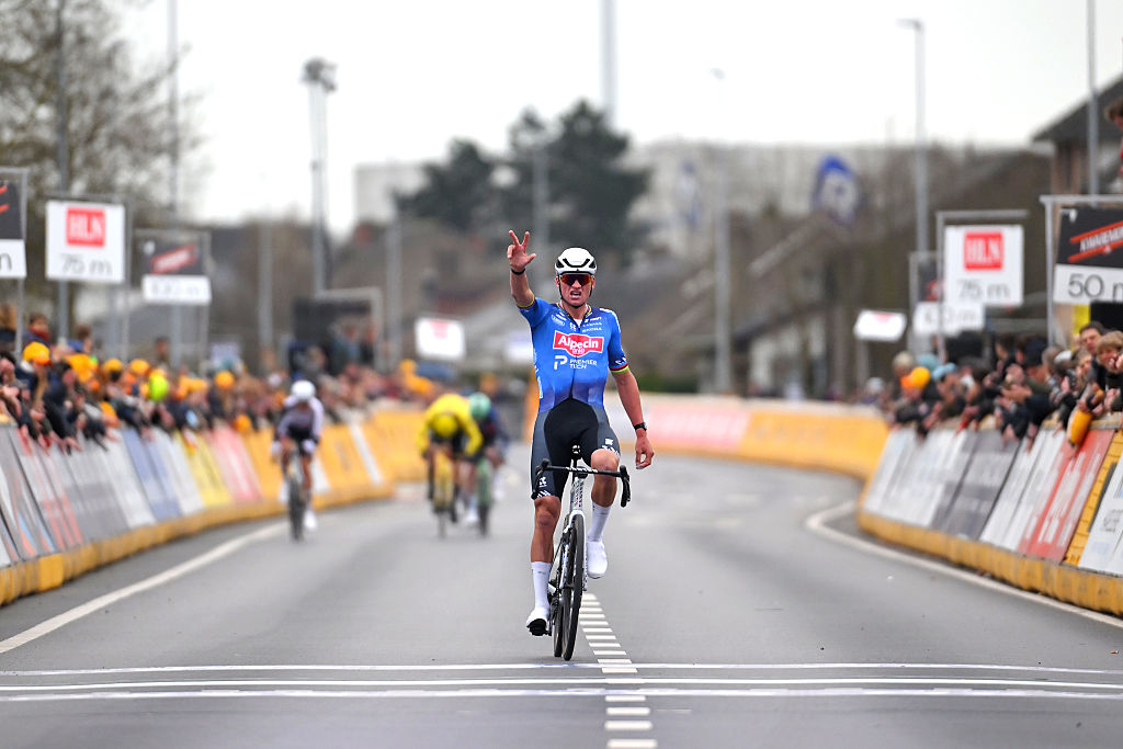 Van der Poel celebrates at the line as the chasing four are just 100 metres behind