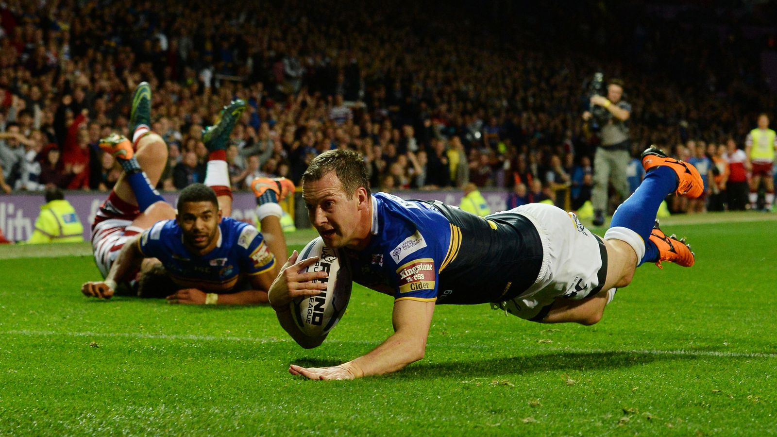 Danny McGuire slides over for a try in Leeds Rhinos' 2015 Super League Grand Final triumph