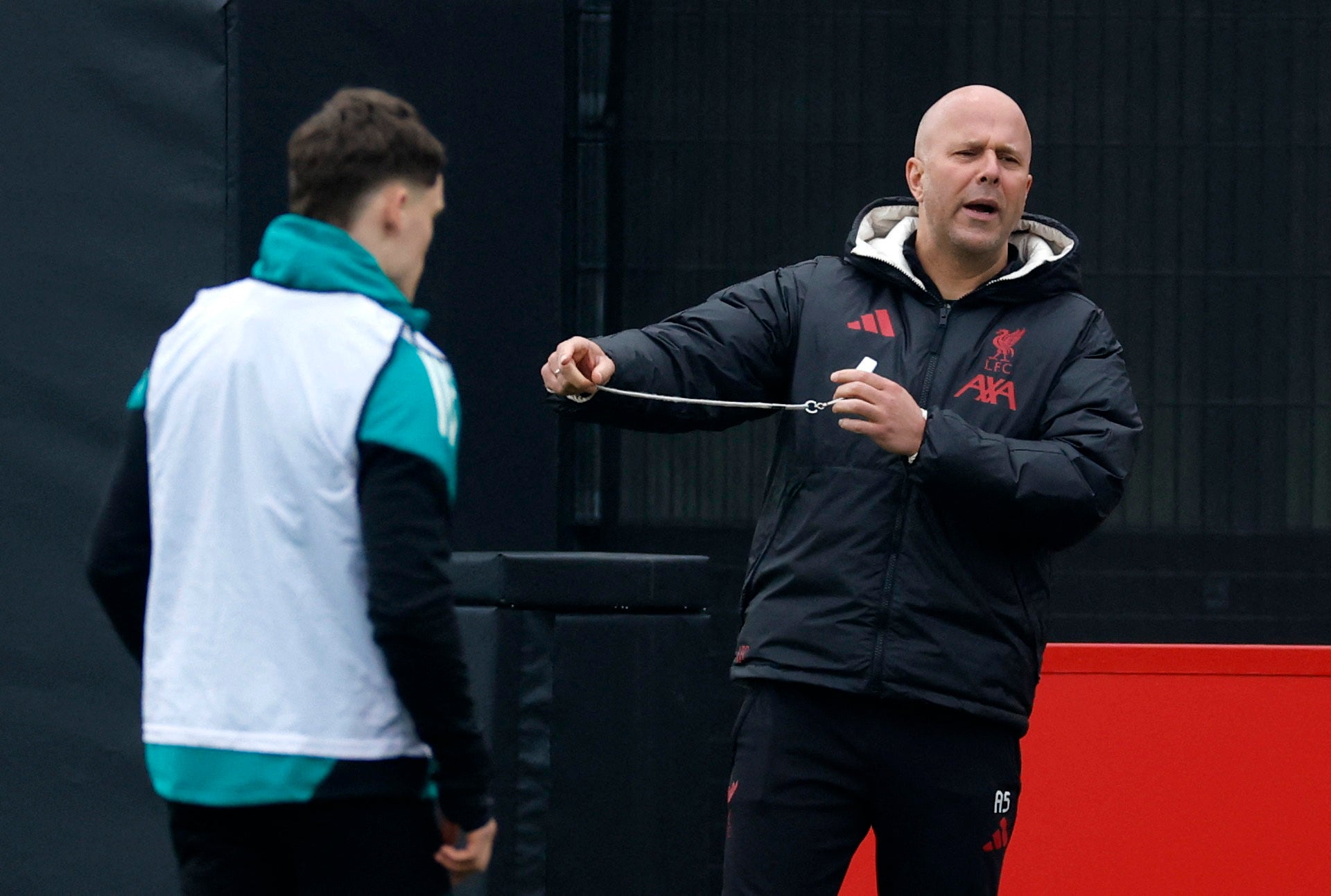 Liverpool’s Florian Wirtz and manager Arne Slot during training