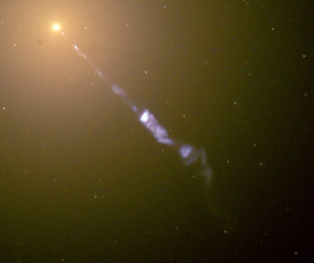 The elliptical galaxy M87 emitting a relativistic jet. When the jet points at Earth it is classed as a blazar and it is these that are thought to have generated some of the most energetic particle yet. (Credit : NASA and The Hubble Heritage Team)