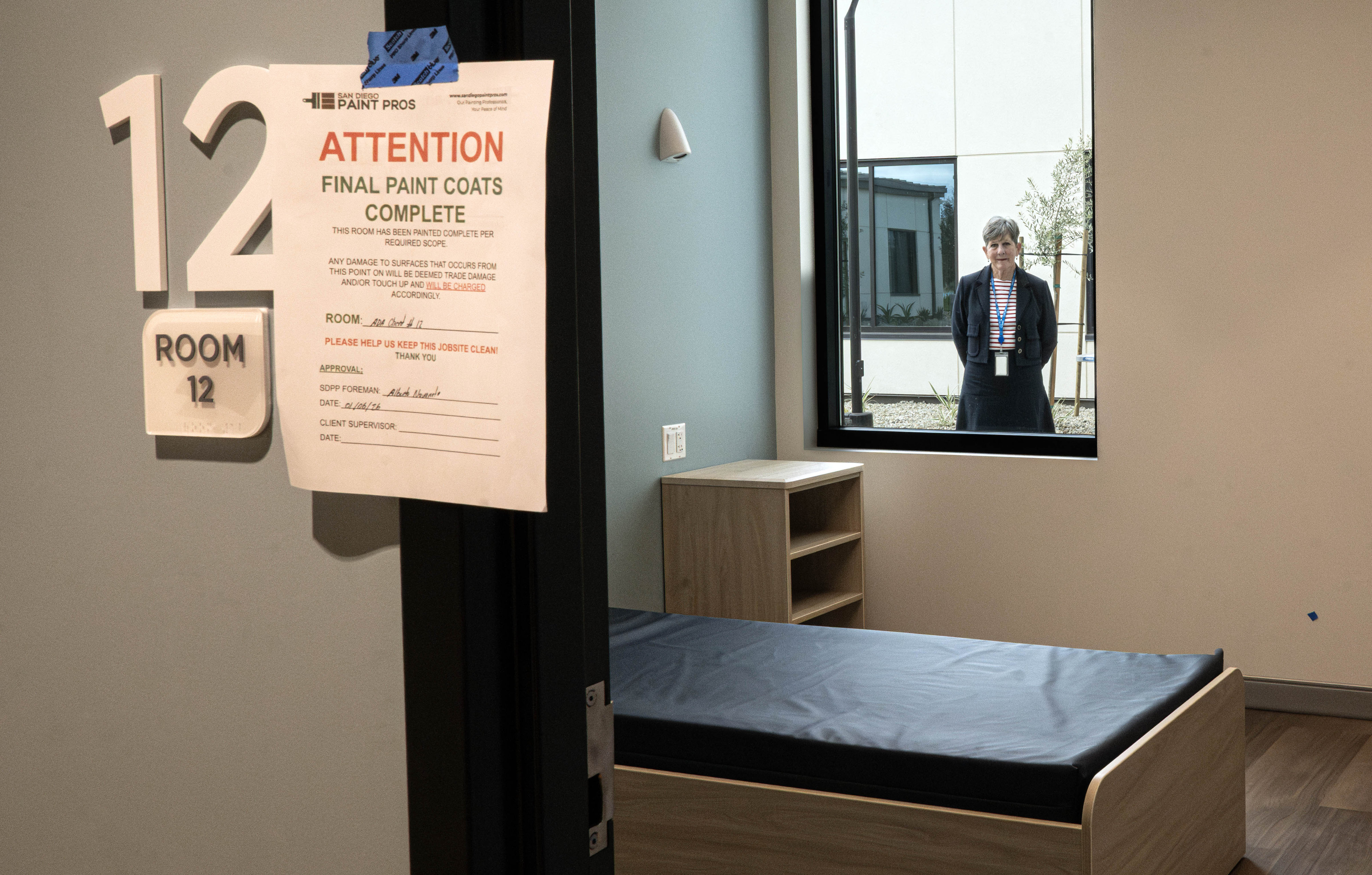 Blair Contratto, chief strategy officer for Be Well OC, stands...