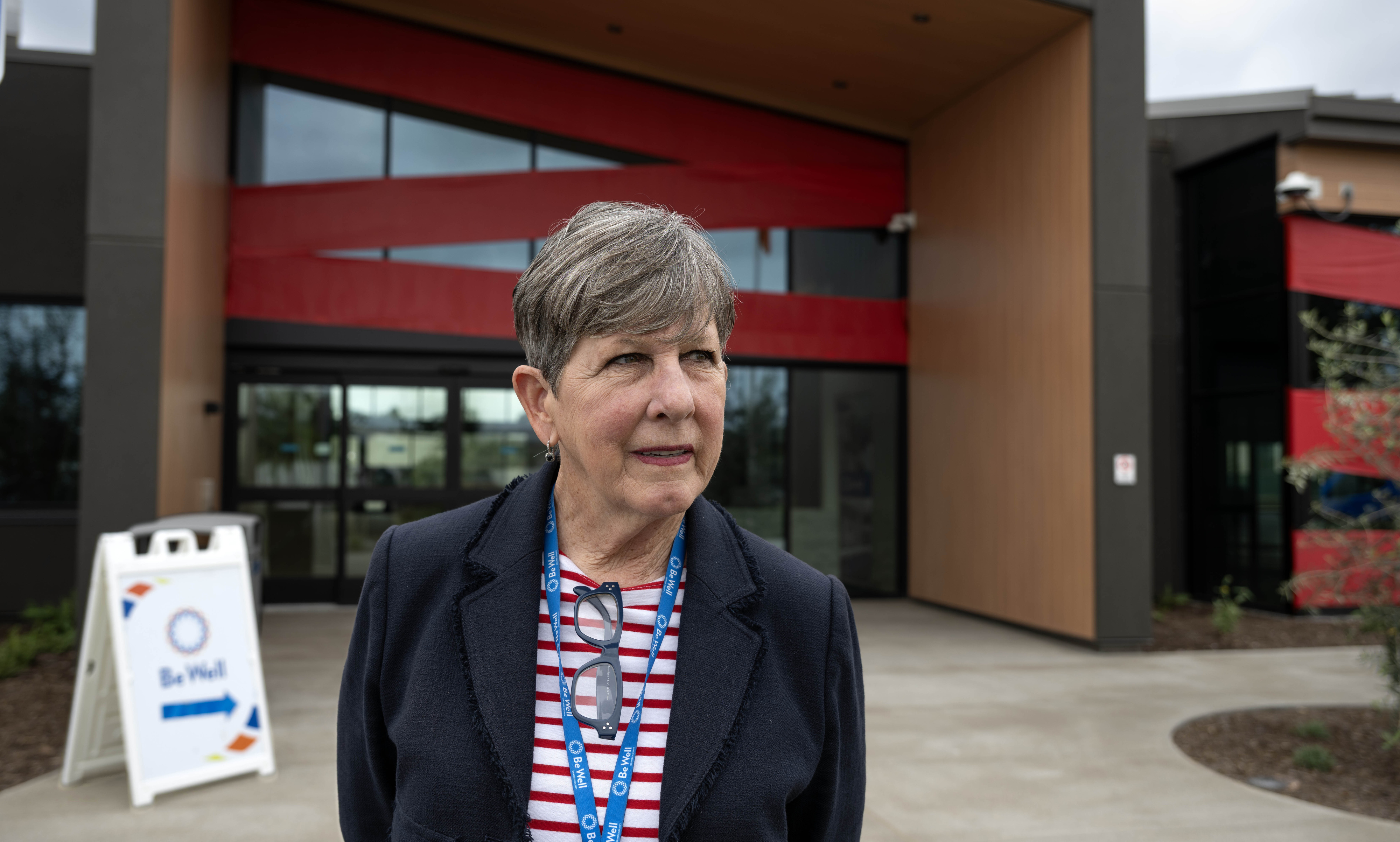 Be Well OC is wrapped in red ribbon, (and red tape),...