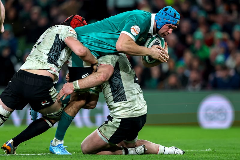 Ireland's Tadhg Beirne is tackled by Wales' James Botham and Dewi Lake. Photograph: Ben Brady/Inpho