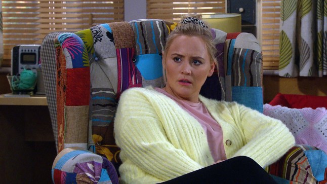 Tracy sat in an armchair in her home in Emmerdale