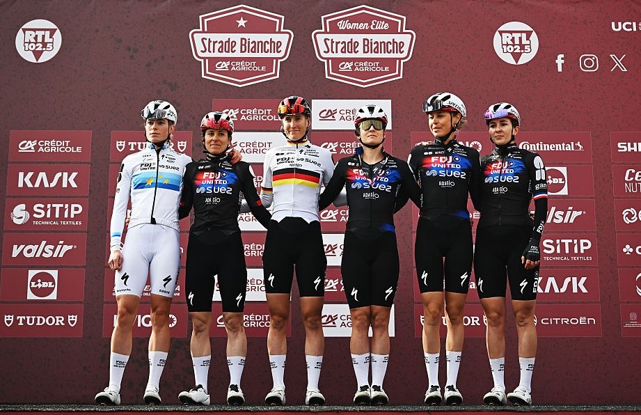 SIENA, ITALY - MARCH 07: Demi Vollering of Netherlands, Juliette Berthet of France, Elise Chabbey of Switzerland, Lea Curinier of France, Franziska Koch of Germany, Amber Kraak of Netherlands and Team FDJ United - SUEZ prior to the 12th Strade Bianche Donne 2026 a 133km one day race from Siena to Siena / #UCIWWT / on March 07, 2026 in Siena, Italy. (Photo by Luc Claessen/Getty Images)