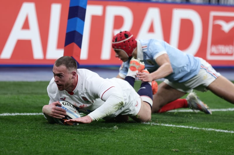 Tom Roebuck of England scores a try. Photograph: Teresa Suarez/EPA