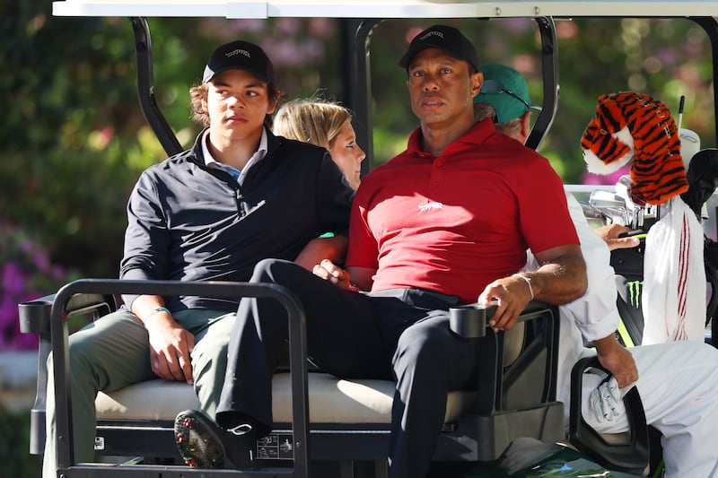Tiger Woods and his son Charlie Woods depart the practice area during the final round of the 2024 Masters. Photograph: Andrew Redington/Getty