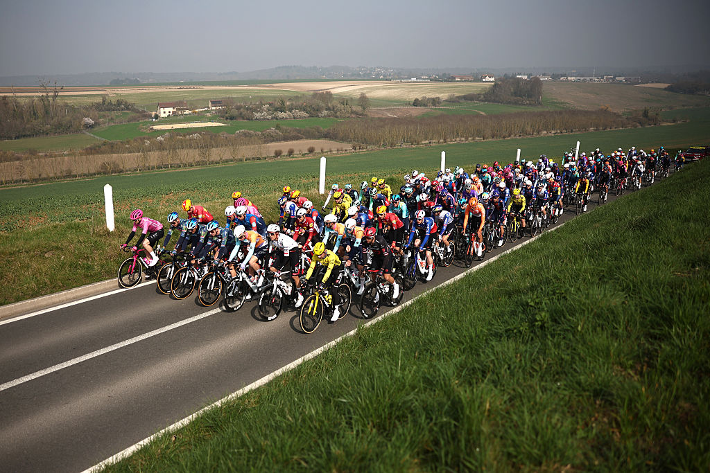 The pack rides during the 1st stage of the Paris-Nice cycling race, 170.9 km between Ach&egrave;res and Carri&egrave;res-sous-Poissy, on March 8, 2026. (Photo by Anne-Christine POUJOULAT / AFP)