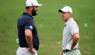Jon Rahm, left, of Spain, talks with Rory McIlroy, of Northern Ireland, on the practice range during a practice round in preparation for the Masters golf tournament at Augusta National Golf Club Tuesday, April 9, 2024, in Augusta, Ga. (AP Photo/Charlie Riedel)
