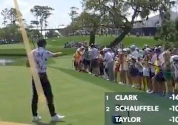 Rickie Fowler points at a fan