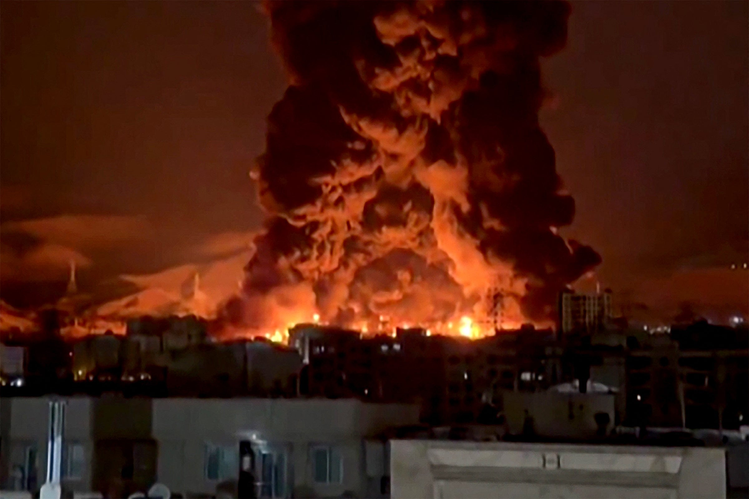 A video grab shows fire erupting at an oil depot in Iran's capital Tehran