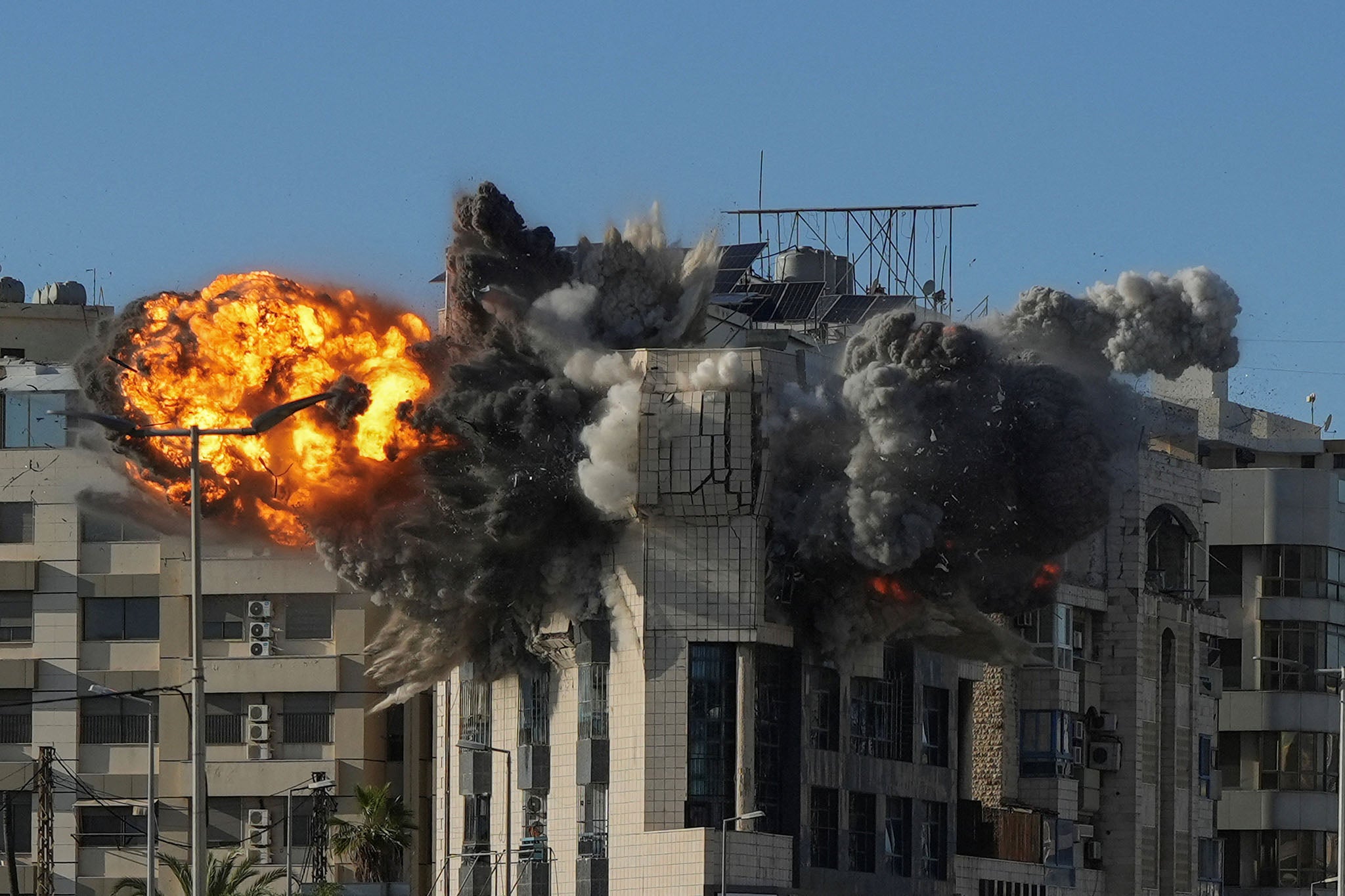 A ball of fire rises from the site of an Israeli strike that targeted a building adjacent to the highway that leads to Beirut’s international airport on March 31, 2026.