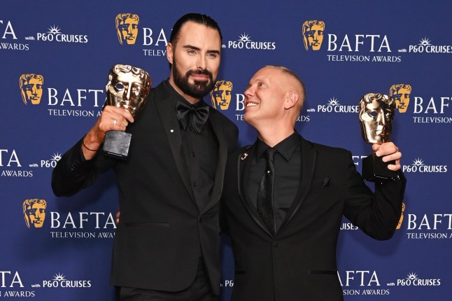 LONDON, ENGLAND - MAY 11: Rylan Clark and Robert Rinder aka Judge Rinder, winners of the Factual Entertainment Award for 'Rob and Rylan's Grand Tour', pose in the winners room at the 2025 BAFTA Television Awards With P&O Cruises at The Royal Festival Hall on May 11, 2025 in London, England. (Photo by Alan Chapman/Dave Benett/Getty Images)