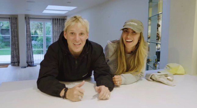 Jamie Laing and Sophie Habboo laughing inside their kitchen.
