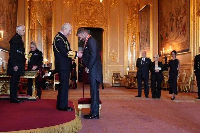 Sir David Beckham is made a Knight Bachelor by King Charles III during an Investiture ceremony at Windsor Castle, Berkshire. The honour recognises services to sport and to charity. Picture date: Tuesday November 4, 2025. PA Photo. Photo credit should read: Jonathan Brady/PA Wire