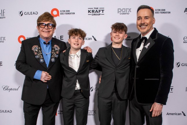 British singer-songwriter Elton John and his partner David Furnins pose with their sons Zachary Jackson Furnish and Elijah Joseph Daniel Furnish as they attend the 33rd Annual Elton John AIDS Foundation Academy awards viewing party at the Pacific Design Center in West Hollywood, California, on March 2, 2025. (Photo by Apu GOMES / AFP) (Photo by APU GOMES/AFP via Getty Images)