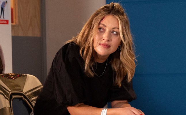 Lou sitting and crying in Coronation Street