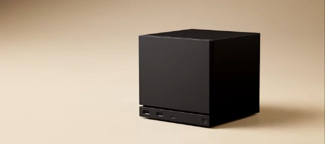 Steam Machine console sat in blank beige room