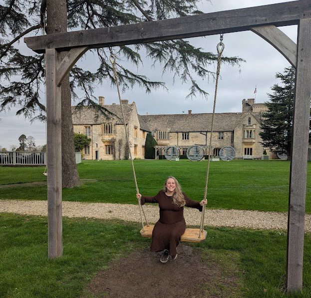 Mel Evans on a swing in the grounds of Ellenborough Park
