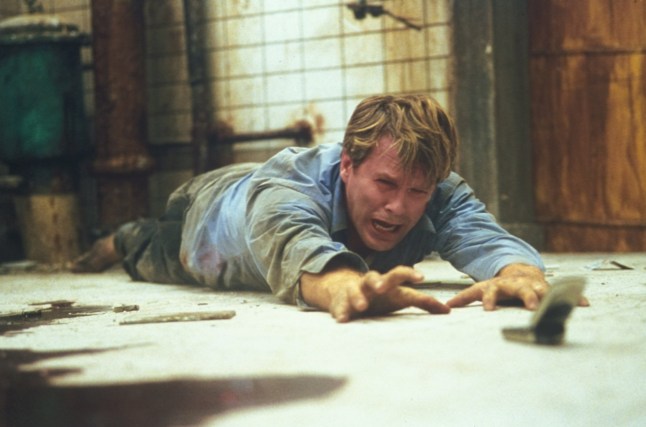 For Editorial Use Mandatory Credit: Photo by THA/Shutterstock (15074545e) Cary Elwes stars as 'Dr, Lawrence Gordon' in SAW. "Saw" (2004) Re-Release in 2014