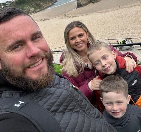 Story from Jam Press (Brain Tumour Diagnosis) Pictured: Lewis with wife Keeley and children Jake and Ralph. ?Test for stomach ache found tumour growing in my BRAIN ? I had surgery while AWAKE to remove it? A man has shared how a simple test for stomach pain resulted in a life-changing diagnosis. Lewis Goodfield had been struggling with abdominal issues for ?several years? ? so much so that the pain had become ?relentless?. When he couldn?t take any more, the services engineer was admitted to hospital with abdominal pains ? but news of a brain tumour was the last thing he was expecting. ?I collapsed in pain while in hospital and nurses assumed I?d had a seizure,? the 37-year-old, from Beddau, Wales, told creatorzine.com. ?Then a CT scan showed a mass on my brain. ?It was a huge shock ? not just for me but for friends and family, too. ?It hit me hard.? Lewis had been focused on getting answers to his stomach issues and never expected to be told something so life changing. The father-of-two had already been admitted to hospital twice for the mystery pain before he visited in March 2025, when he collapsed in agony. Concerned he?d had a seizure, staff performed a CT scan, which revealed the mass. The following month, Lewis was told by doctors he had a grade two glioma, a form of brain tumour that often progresses to a higher grade through time. The stomach pain is believed to be unrelated, meaning the tumour was found by chance. Recalling the moment he was told about the mass, Lewis said: ?It was a massive shock. ?It was slow growing, not aggressive. ?Recovery has been tough but it's going well. ?I'm just trying to remain as strong as I can.? Lewis was given with two options: to monitor the mass, or surgery to remove it. He opted for surgery ? a craniotomy procedure where a section of the skull is temporarily removed to access the brain, which he remained awake for ? in July last year. Lewis added: ?I could hear all the drilling and conversations. ?It was really strange and just a lot to take in. ?My neurosurgeon showed me the tumour in the palm of her hand. ?I was a bit shocked to see it. ?It was about the size of an egg. ?It's a lot to deal with.? Lewis? operation was a success and the brain tumour was not cancerous, so doctors believed it was found early enough. He praised his family, particularly wife Keeley, for their help with his recovery. He added: ?Keeley has borne the most of this. ?She's had support from family and friends but she's largely dealt with it all on her own. ?I would never?had?been able to remain positive or stick with my daily tasks if it?wasn?t?for Keeley. ?She has been incredible, especially with me not being able to drive. ?The pair of us have really fought and recently the realisation of what we've been through has kicked in. ?We've been reflecting on that?and?it's?really hit home.? Since the surgery, he has been unable to drive or work, and his mysterious stomach issues have continued ? leaving him returning to hospital frequently, including in March for the fifth time this year. He said: ?I can't live my life like this. ?I've tried different diets and gave up spicy foods, then I gave up alcohol for a couple of months ? all sorts. ?It doesn't help. ?I think I've now had 10 CT scans, various MRI scans and x-rays, a colonoscopy and two endoscopies and I've got another one scheduled for this week. ?Then I need a capsule test, where you swallow a capsule and they track it through your digestive system.? So far, Lewis? doctors have been unable to diagnose his stomach problems. He added: ?My consultants are confused about what this might be. ?It's a bit of a mystery. ?One of them said, ?You might have to live with this?. ?I said, ?I'm sorry, I can't, there's got to be an answer?.? Meanwhile, the brain surgery has had a strong impact on his life, too. Since having the mass removed from his brain, Lewis now struggles with busy environments, while noise and bright lights bother him more than before. He?s also had to build up his memory function, which he says is improving week by week with the help of family and friends. Lewis has even been raising money for The Brain Tumour Charity and has raised more than ?3,600 despite having to postpone The Twilight Walk due to his stomach issues. He said that while his two children, Jake and Ralph, were ?fairly unaware? of his full diagnosis for a while, he?d shared the importance of the charity with them when arranging his fundraising efforts. He added: ?I need to be fit enough to do [the walk] but talking about this has been fantastic. ?I've had so many messages of support and people joining the walk - some I only know through a friend of a friend. ?Some have been affected by similar issues. ?It's so good for us to talk things through. ?I thought there would be 10-15 people on the walk but now there are 60 plus - I've created an event in my small village. ?I went to a meeting last November and was asked to speak, and from that point onwards I've had this positive mentality about staying committed.? ENDS