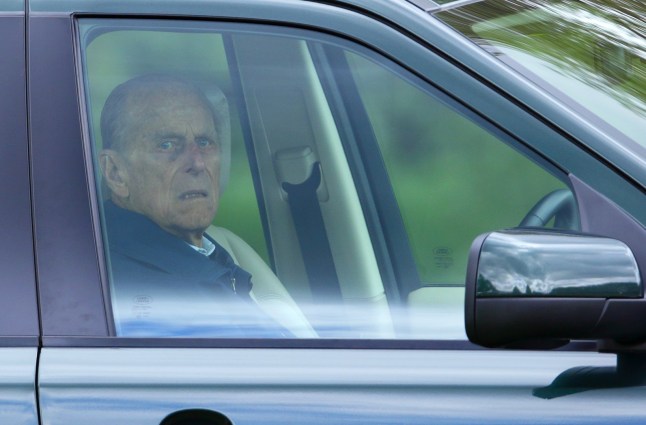 The Duke of Edinburgh seen through a car window