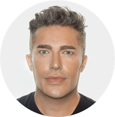 A headshot of a man wearing a black t-shirt