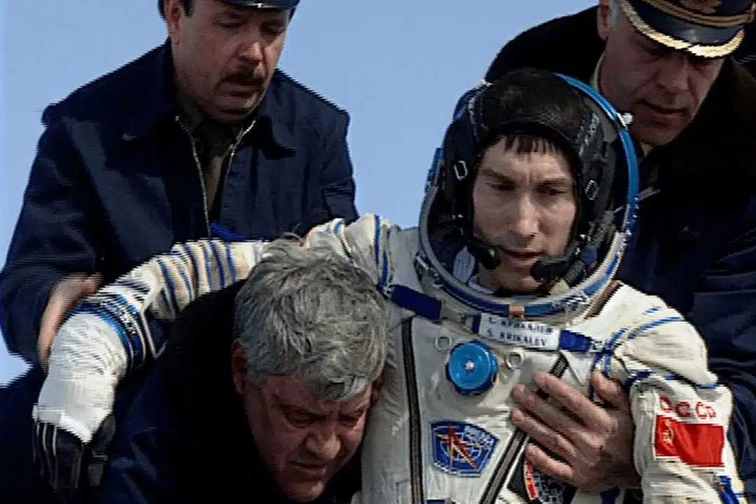 Sergei Krikalev, The Former Soviet Cosmonaut, Is Helped Out Of His Capsule After Landing On Earth Following His Extended Mission In Space.