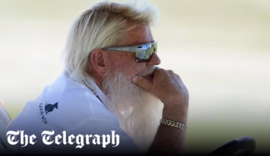 John Daly falls down steep slope as caddie jumps to the rescue