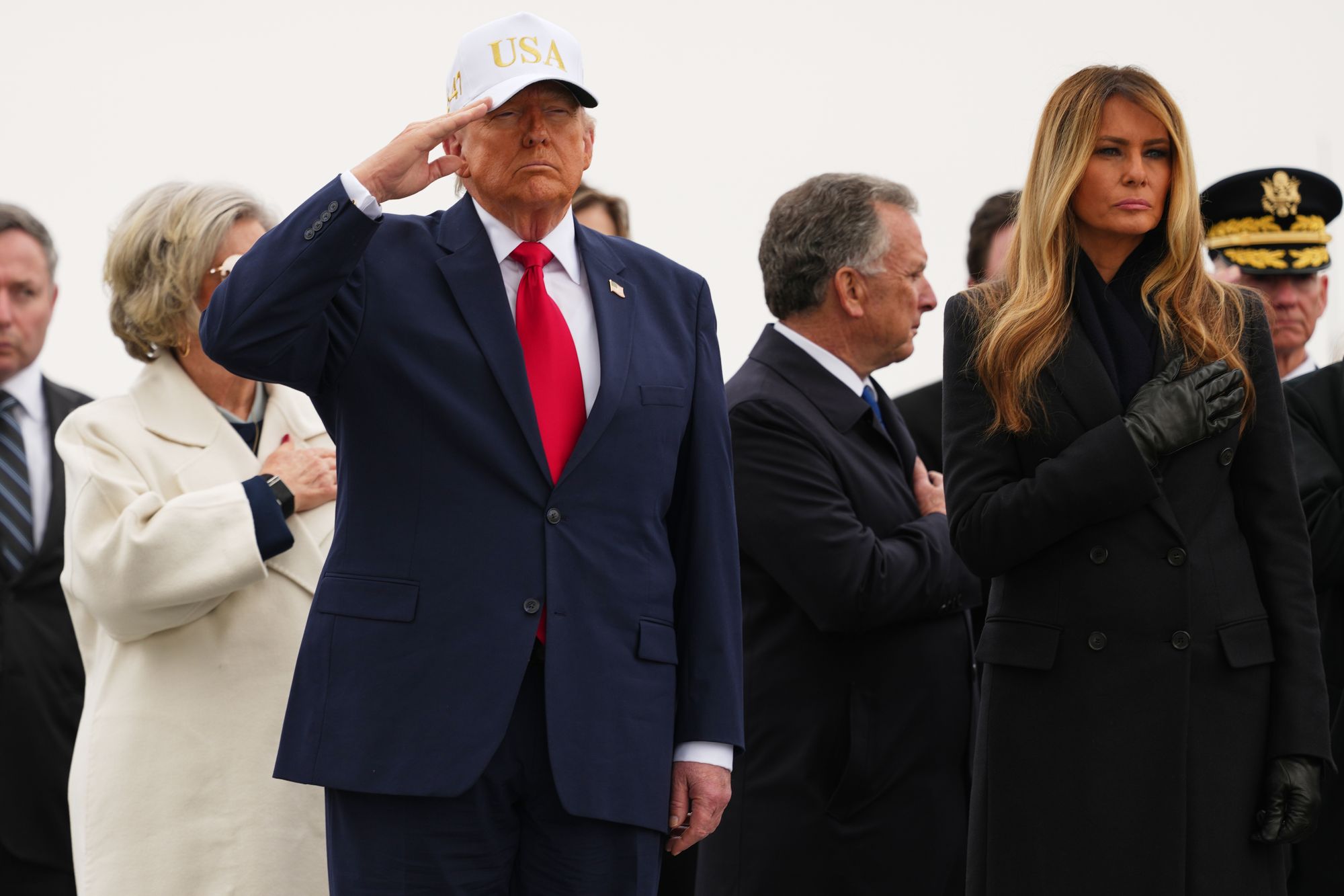 President Donald Trump and first lady Melania Trump attend a casualty return for the soldiers who were killed in a drone strike at a command center in Kuwait