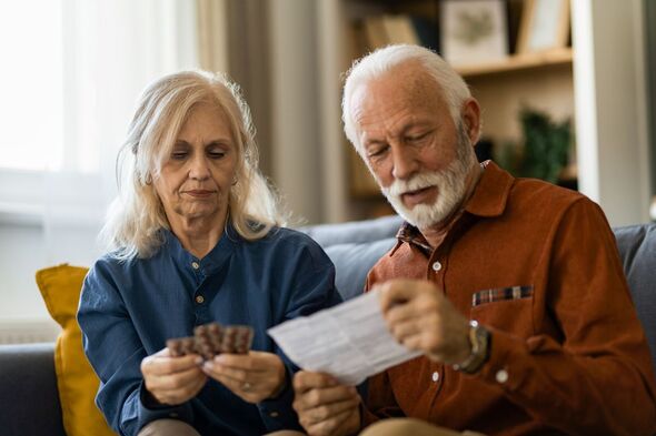 Two pensioners looking at their retirement pot