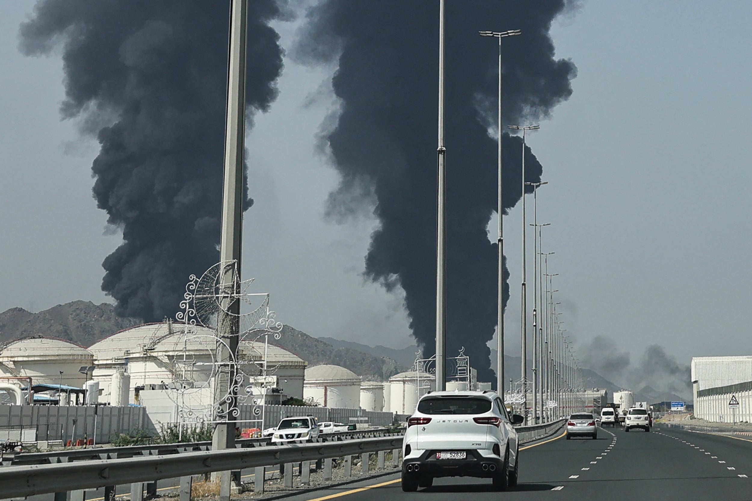 Smoke rises from the direction of an energy installation in the Gulf emirate of Fujairah on 14 March