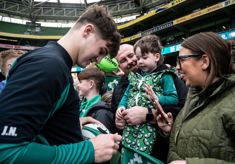 Josh Neill signs autographs after Ireland's open training session. Photograph: Henry Simpson/Inpho