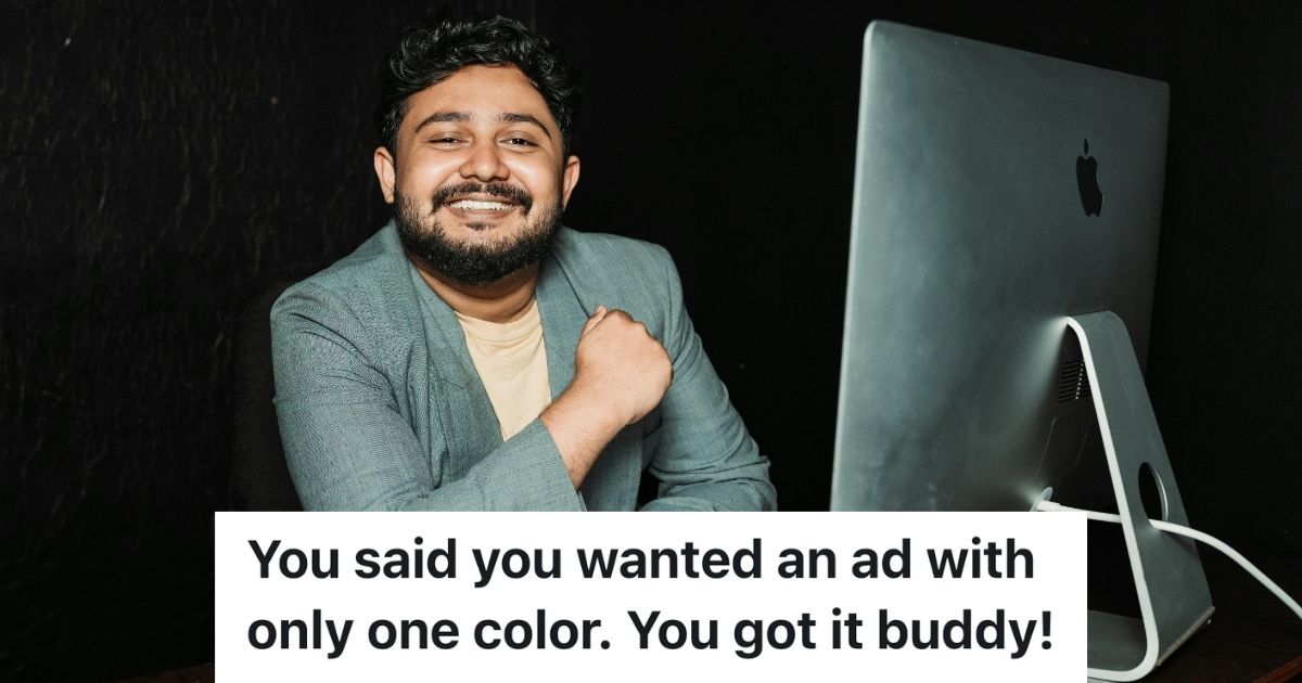 Man smiling while at computer