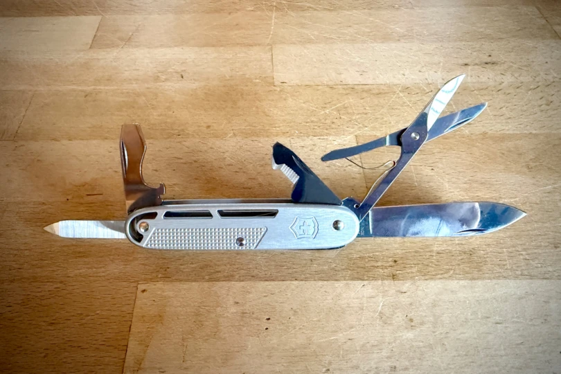 Victorinox Synergy X Alox with blade, scissors, bottle opener, and other tools extended