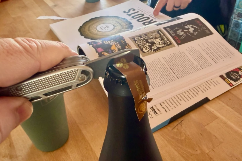 Victorinox Synergy X Alox opening a bottle cap during a bottle share