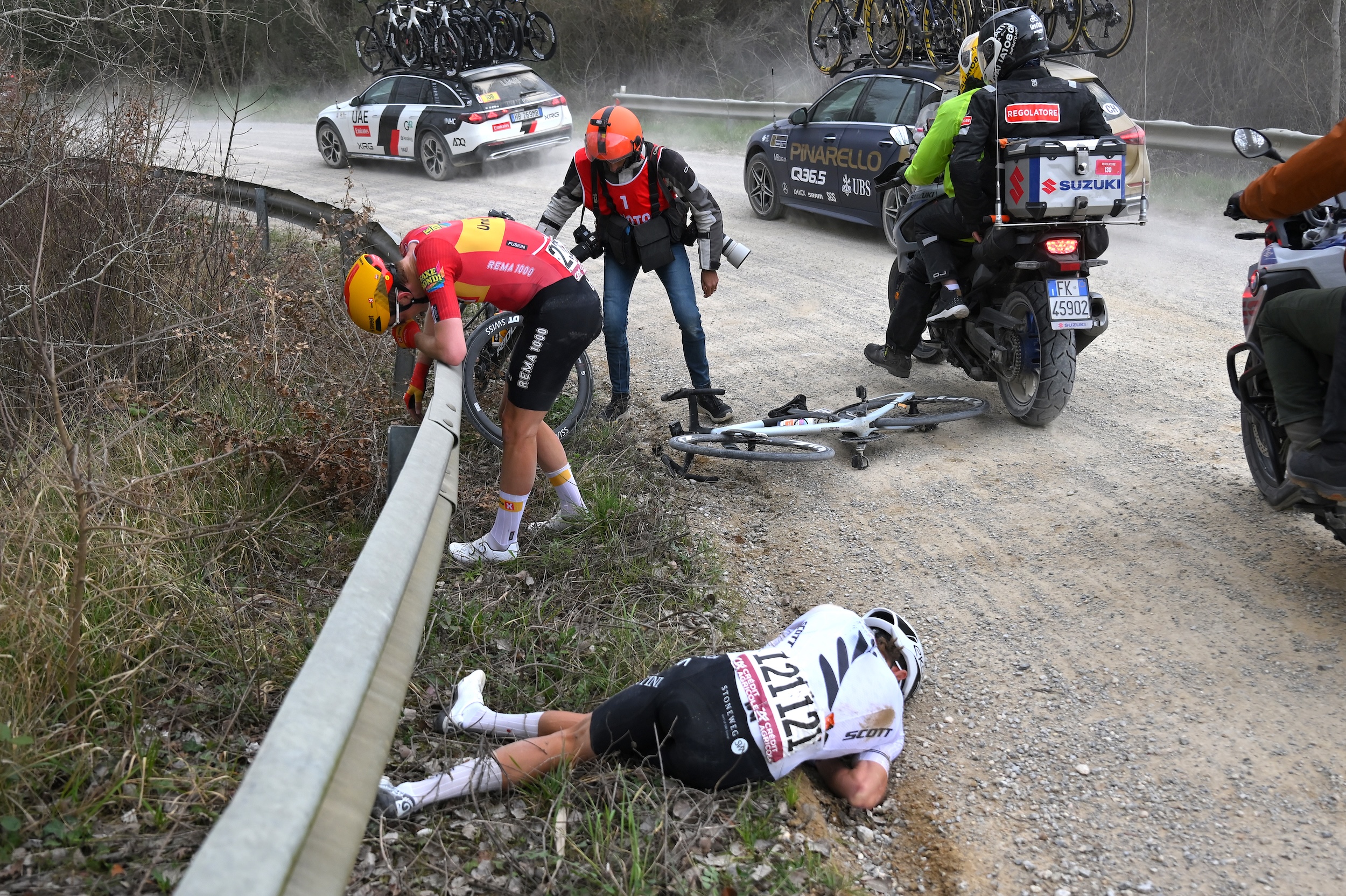 SIENA, ITALY - MARCH 07: (L-R) Markus Hoelgaard of Norway and Team Uno-X Mobility and George Bennett of New Zealand and Team NSN Cycling after being involved in a crash during the 20th Strade Bianche 2026 a 203km one day race from Siena to Siena / #UCIWT / on March 07, 2026 in Siena, Italy. (Photo by Tim de Waele/Getty Images)