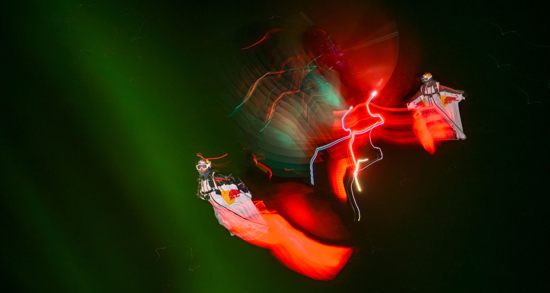 Photographer captures seemingly impossible long exposure action shot of skydivers against the northern lights while flying over 100MPH in sub-zero temperatures