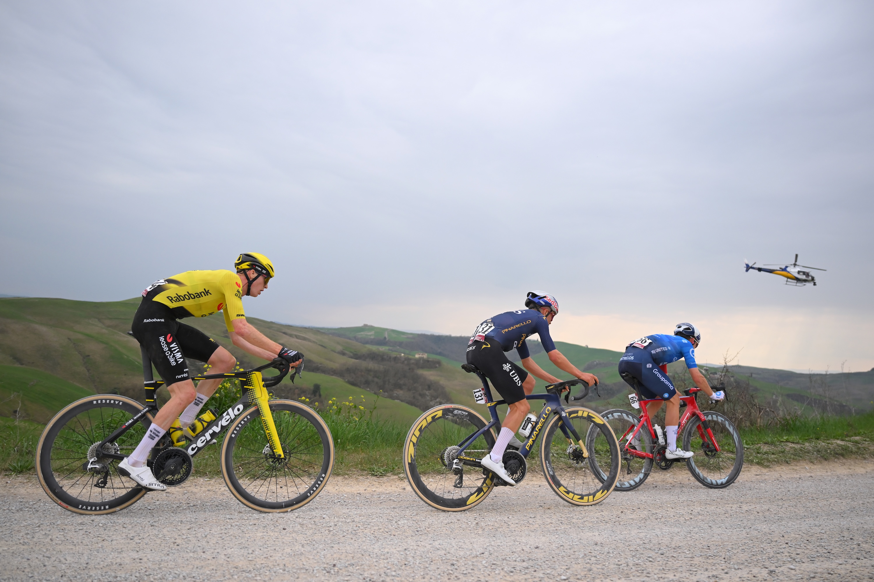 SIENA, ITALY - MARCH 07: (L-R) Matteo Jorgenson of United States and Team Visma | Lease a Bike, Thomas Pidcock of Great Britain and Team Pinarello Q36.5 Pro Cycling and Romain Gregoire of France and Team Groupama - FDJ United compete in the chase group during the 20th Strade Bianche 2026 a 203km one day race from Siena to Siena / #UCIWT / on March 07, 2026 in Siena, Italy. (Photo by Tim de Waele/Getty Images)