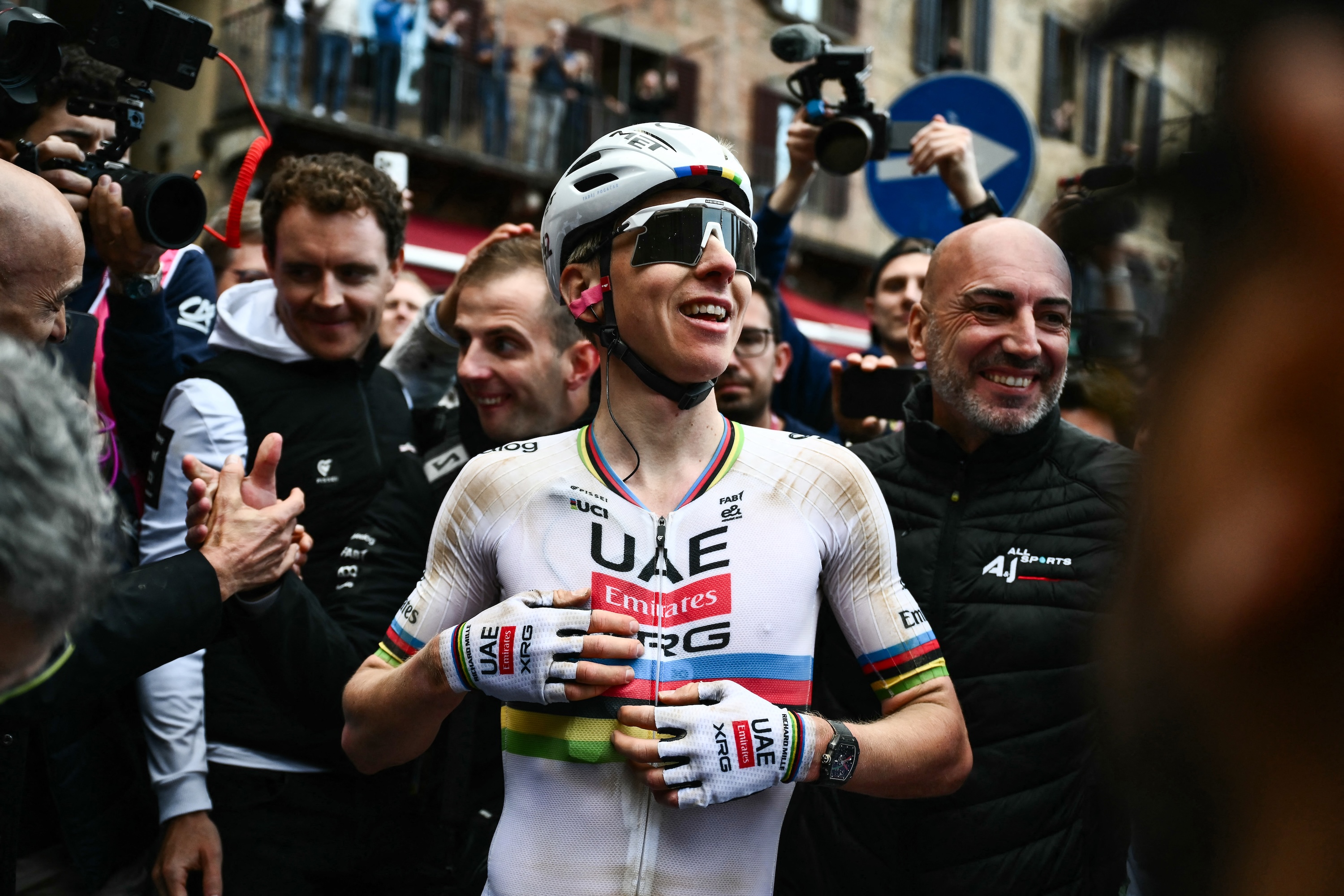 UAE Team Emirates's Slovenian Tadej Pogacar celebrates after winning the 20th one-day classic 'Strade Bianche' (White Roads) men's cycling race between Siena and Siena in Tuscany on March 7, 2026. (Photo by Marco BERTORELLO / AFP)