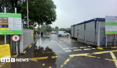 The entrance to a household recycling centre on a cloudy day