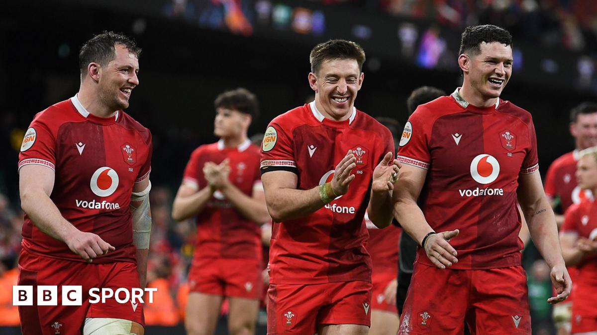 Wales players Ryan Elias, Josh Adams and James Botham celebrate after beating Italy