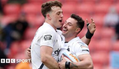 Bath's Bernard van der Linde hugs team-mate Louie Hennessey in celebration