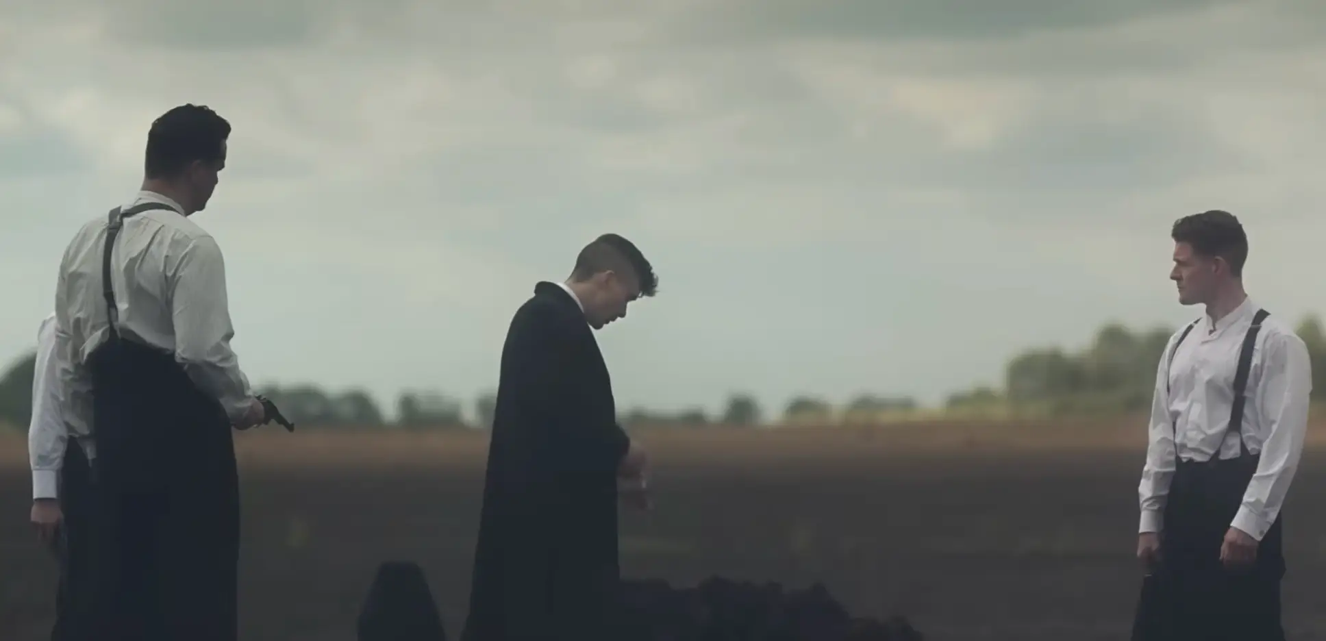 Tommy Shelby is made to stand in a pre-dug grave, but survives (BBC)