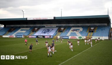 A men's rugby league match takes place at Featherstone Rovers' Millennium Stadium. The players are in action.