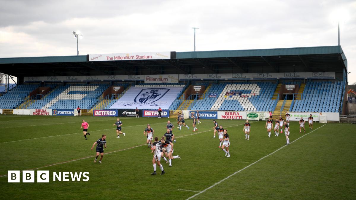 A men's rugby league match takes place at Featherstone Rovers' Millennium Stadium. The players are in action.