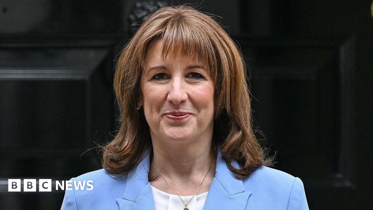 Head and shoulders shot of Rachel Reeves wearing a blue jacket, white shirt and gold necklace